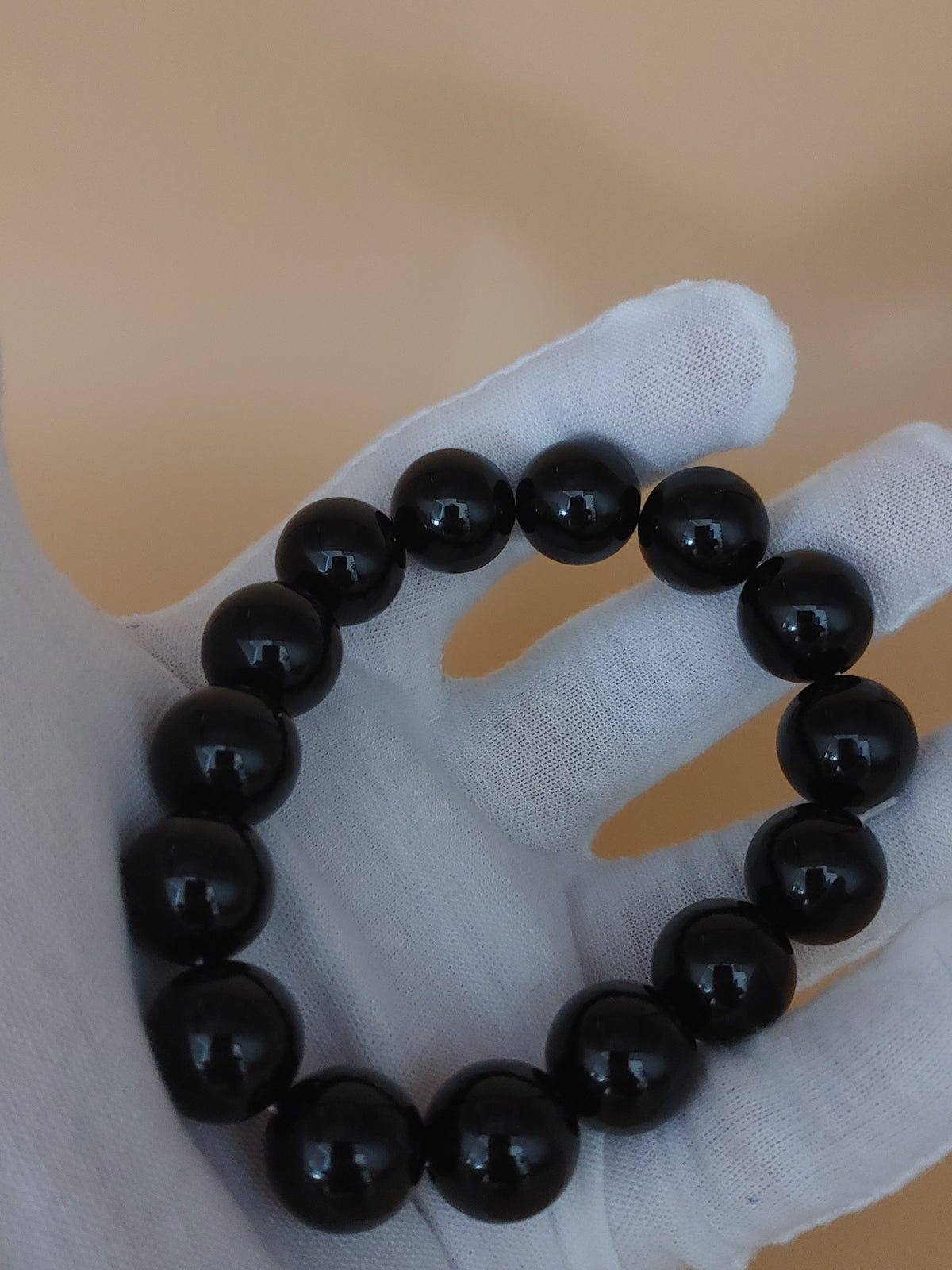 Midnight Black 12.4 mm Obsidian Bracelet (#B901) — hand-held view