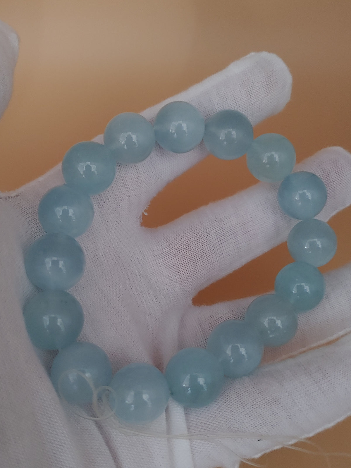 Pale Aqua 13.8 mm Aquamarine Bracelet (#B903) - hand-held view