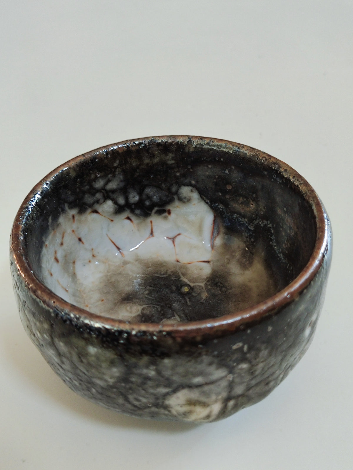 Stone, Shadow, and Snow — Shino Wood-Fired Teacup — product view 2