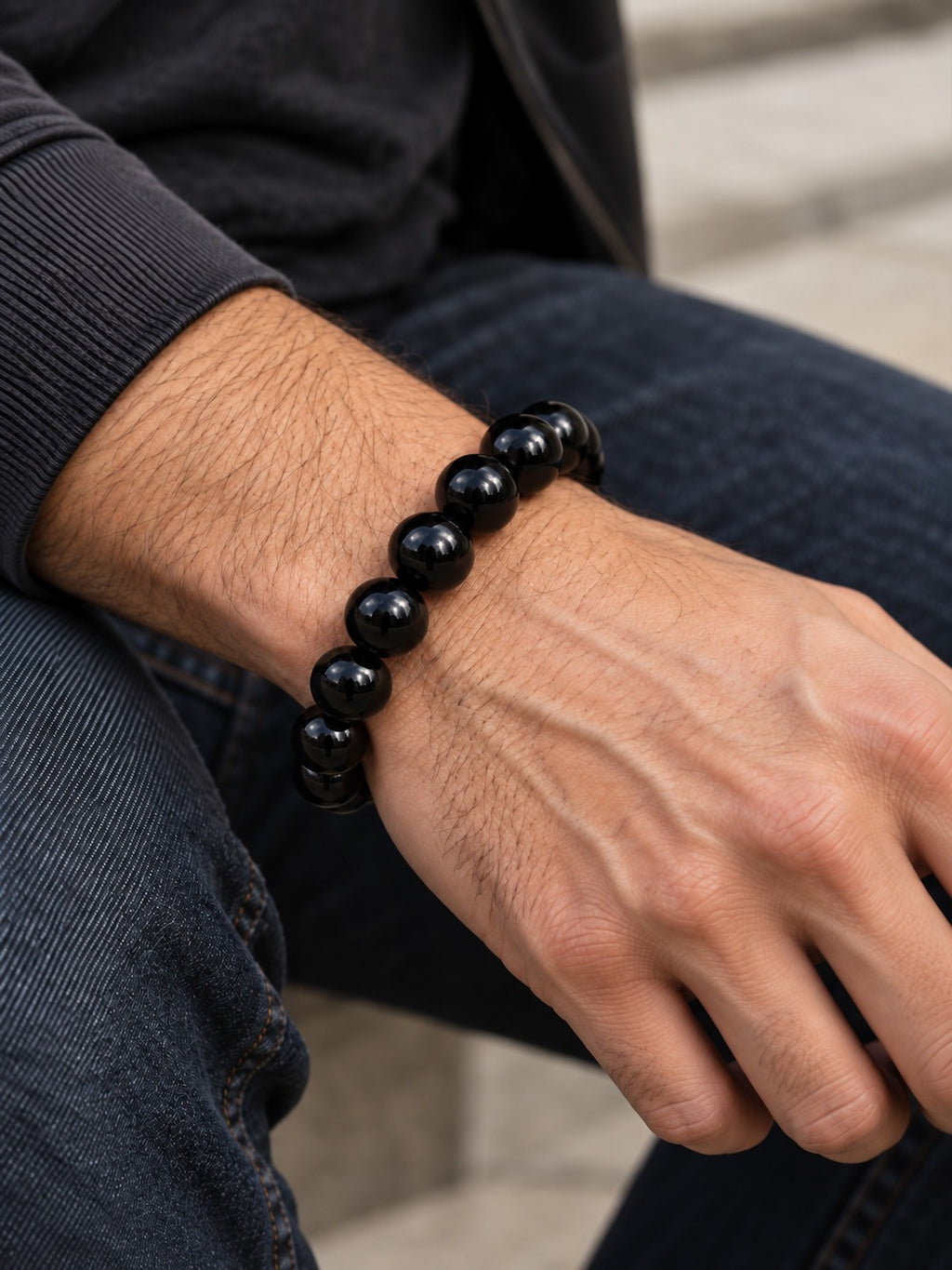 Midnight Black 12.4 mm Obsidian Bracelet (#B901) worn on a man's wrist