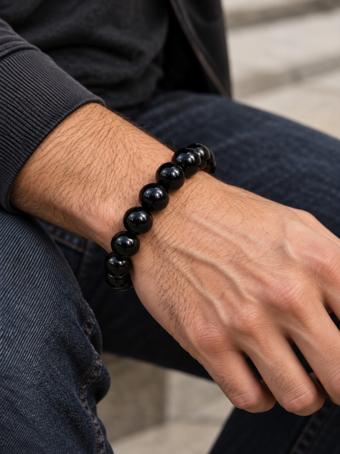 Midnight Black 12.4 mm Obsidian Bracelet (#B901) worn on a man's wrist