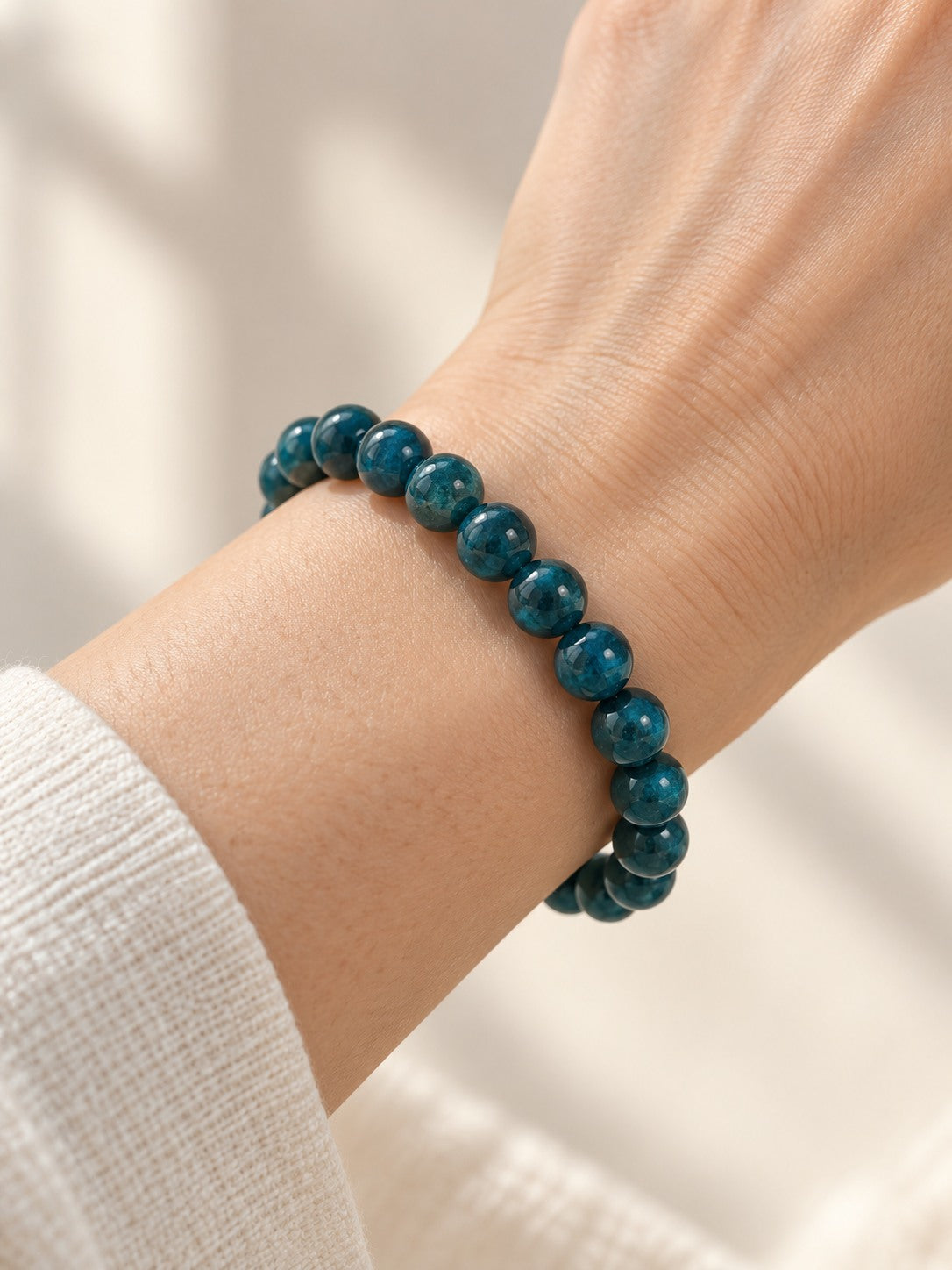 Deep Teal 9.7 mm Blue Apatite Bracelet (#B909) worn on a wrist